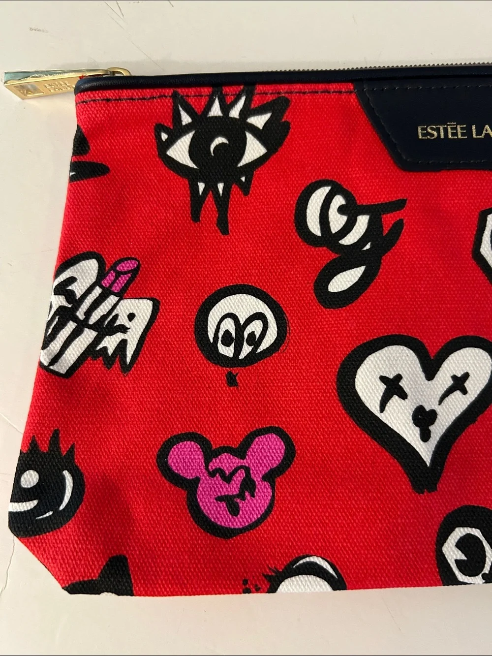 Estée Lauder Red Cosmetic Pouch with beasts, Mickey heads and cute graphics